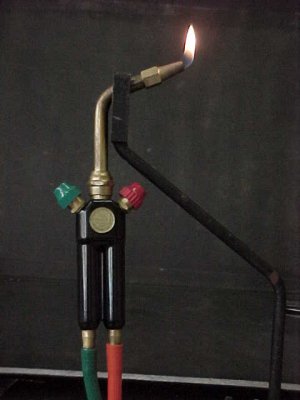 a handheld glassblowing torch